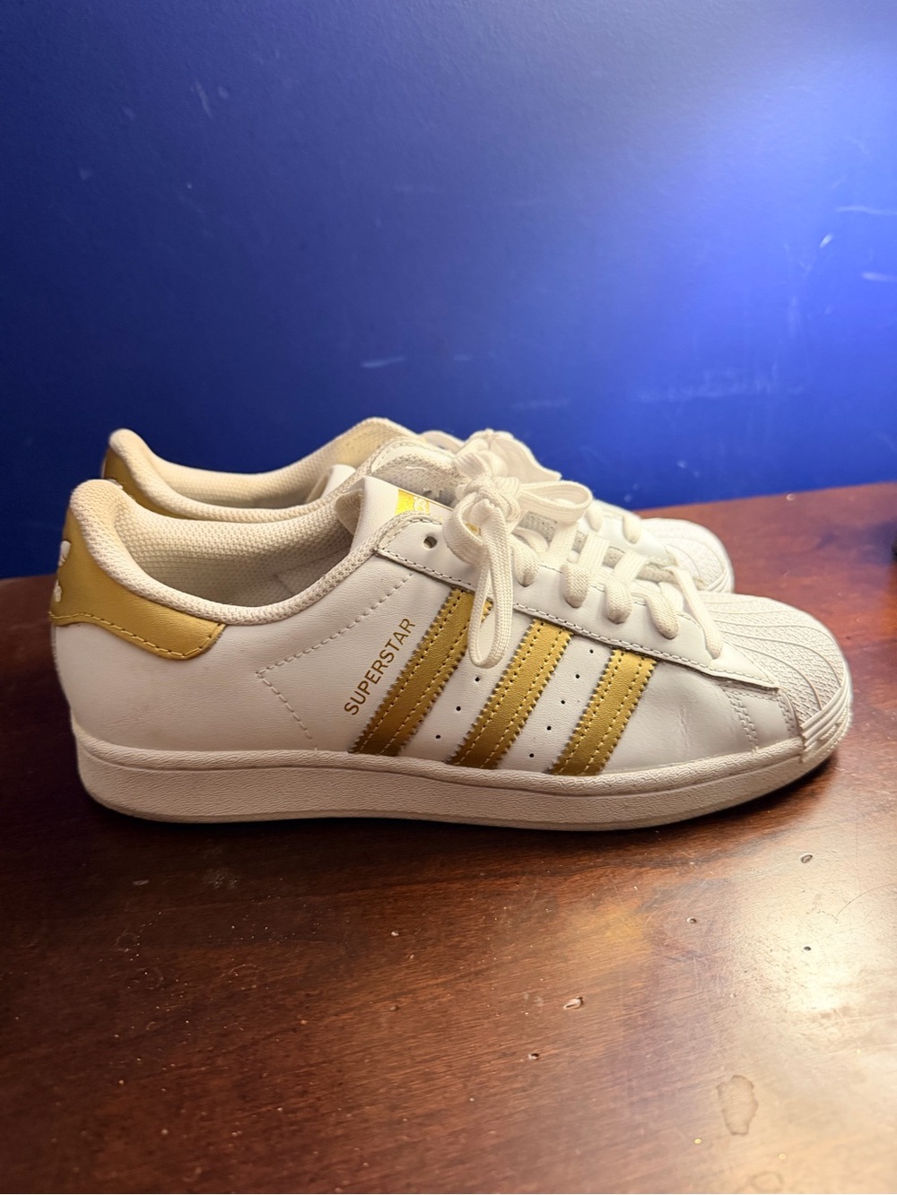 adidas Women’s Superstar Sneakers in White and Gold